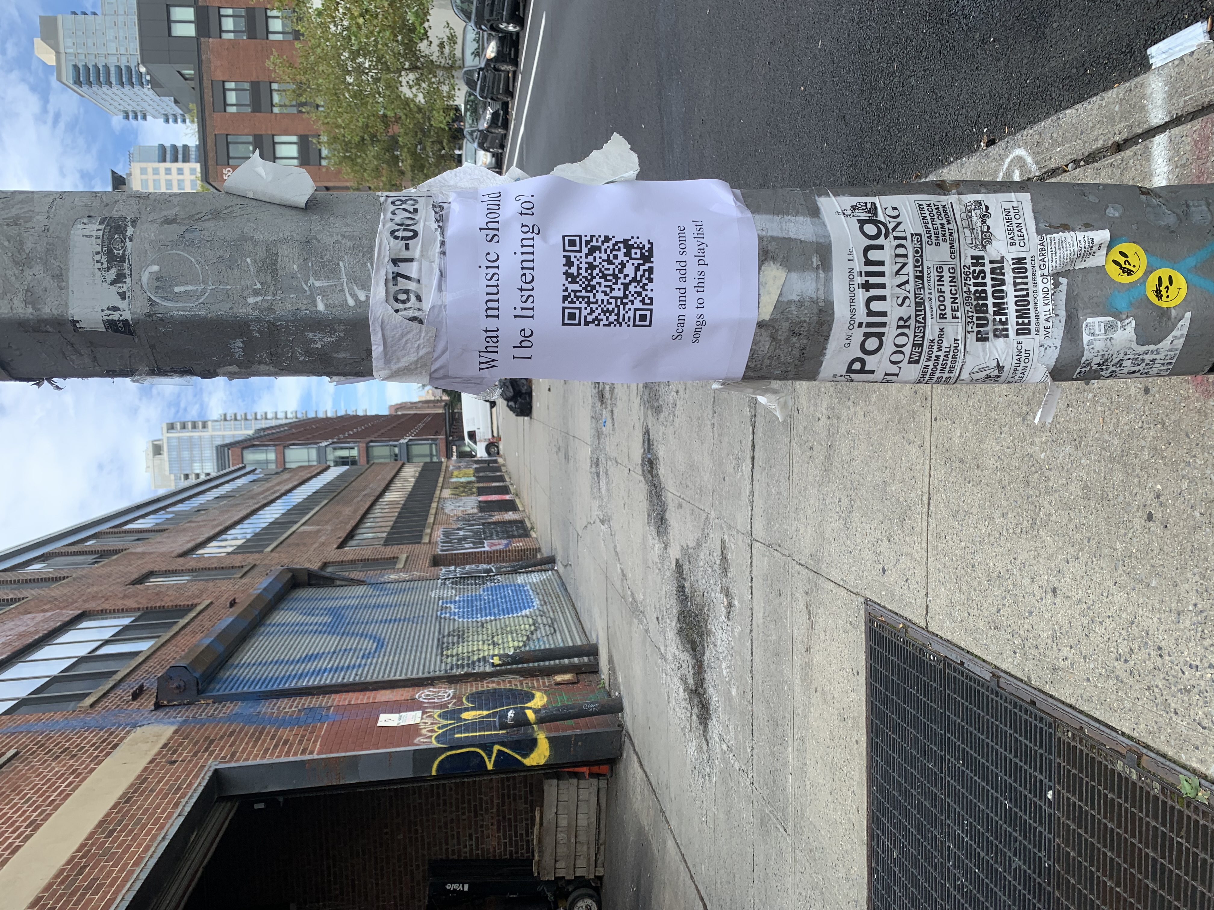 a picture of the flyer taped to a pole with other notices
